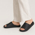 Black EVA platform slide slippers worn while standing
