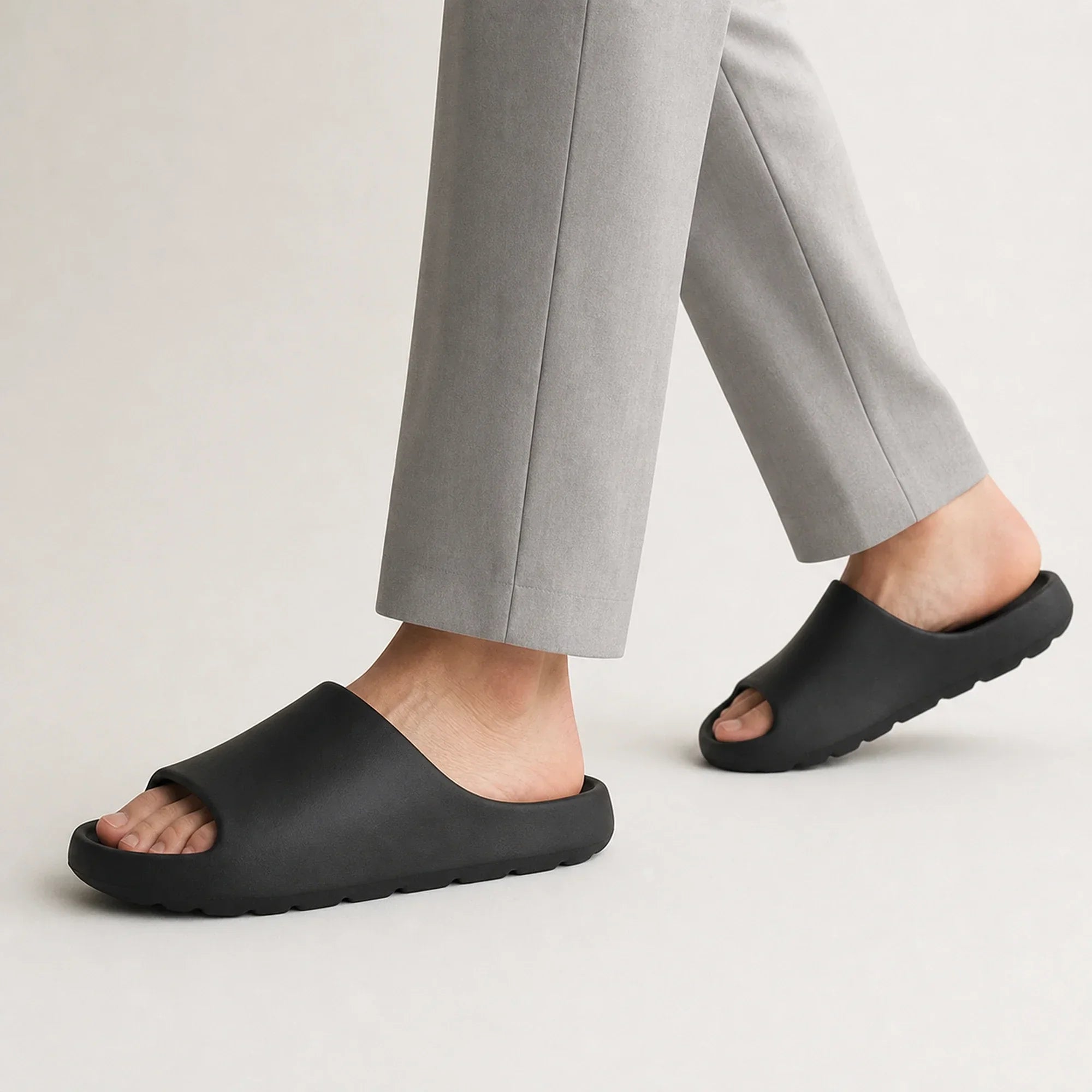 Black EVA platform slide slippers in motion
