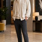 Men wearing black slip-on loafers in a hotel