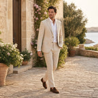 Men walking in beige linen-blend suit by the coast
